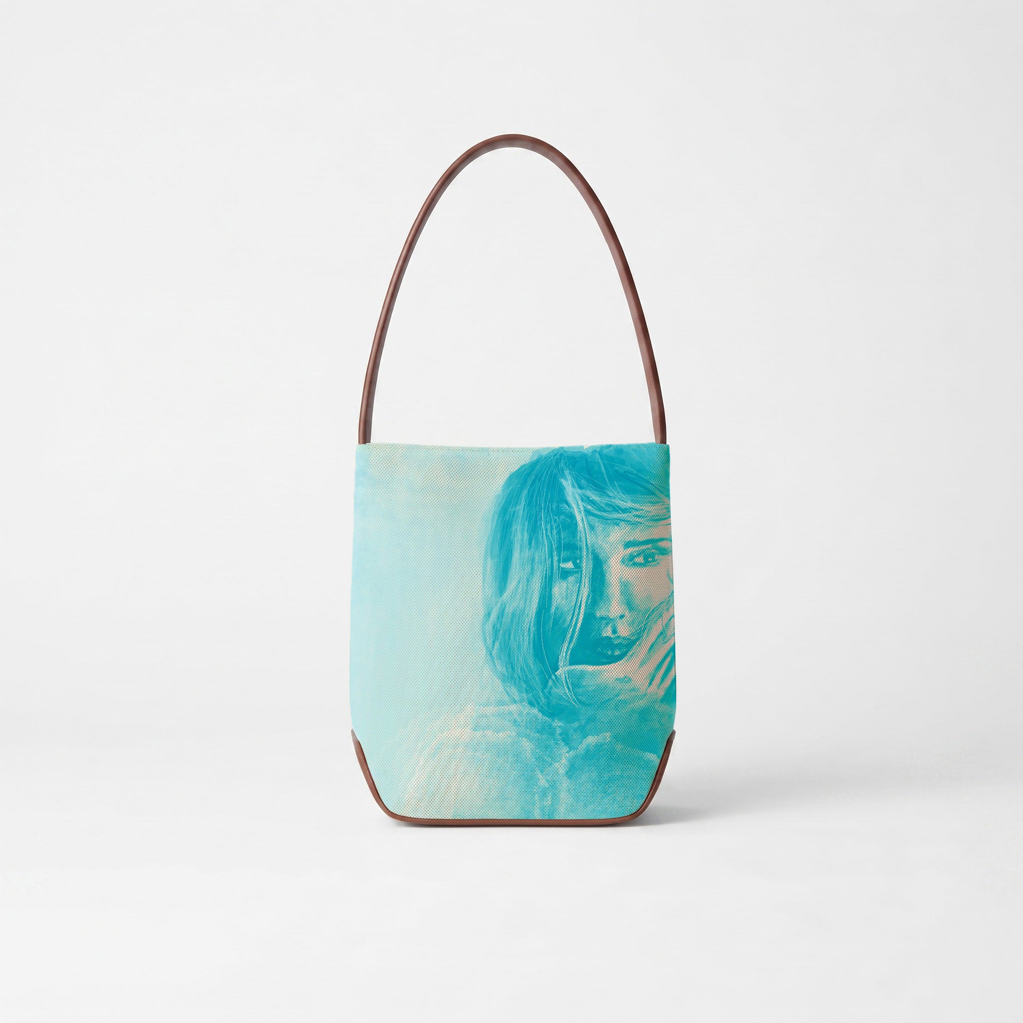 pure cotton off white canvas bag with calfskin brown leather trim handle and bottom, the front panel printed with beautiful artwork 