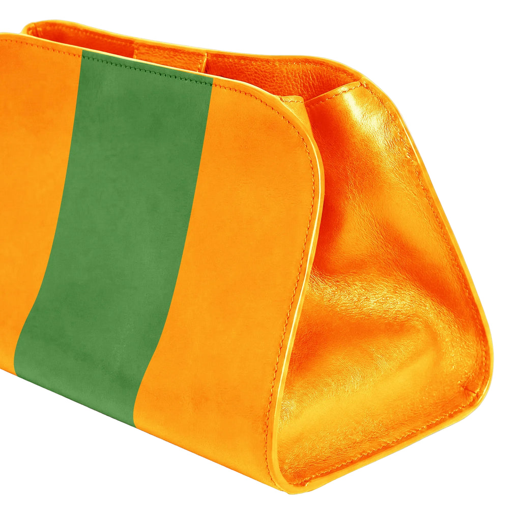 A close-up of a leather pouch or clutch with a bold color-blocked design featuring a wide green stripe flanked by two bright yellow sections, set against a clean white background.