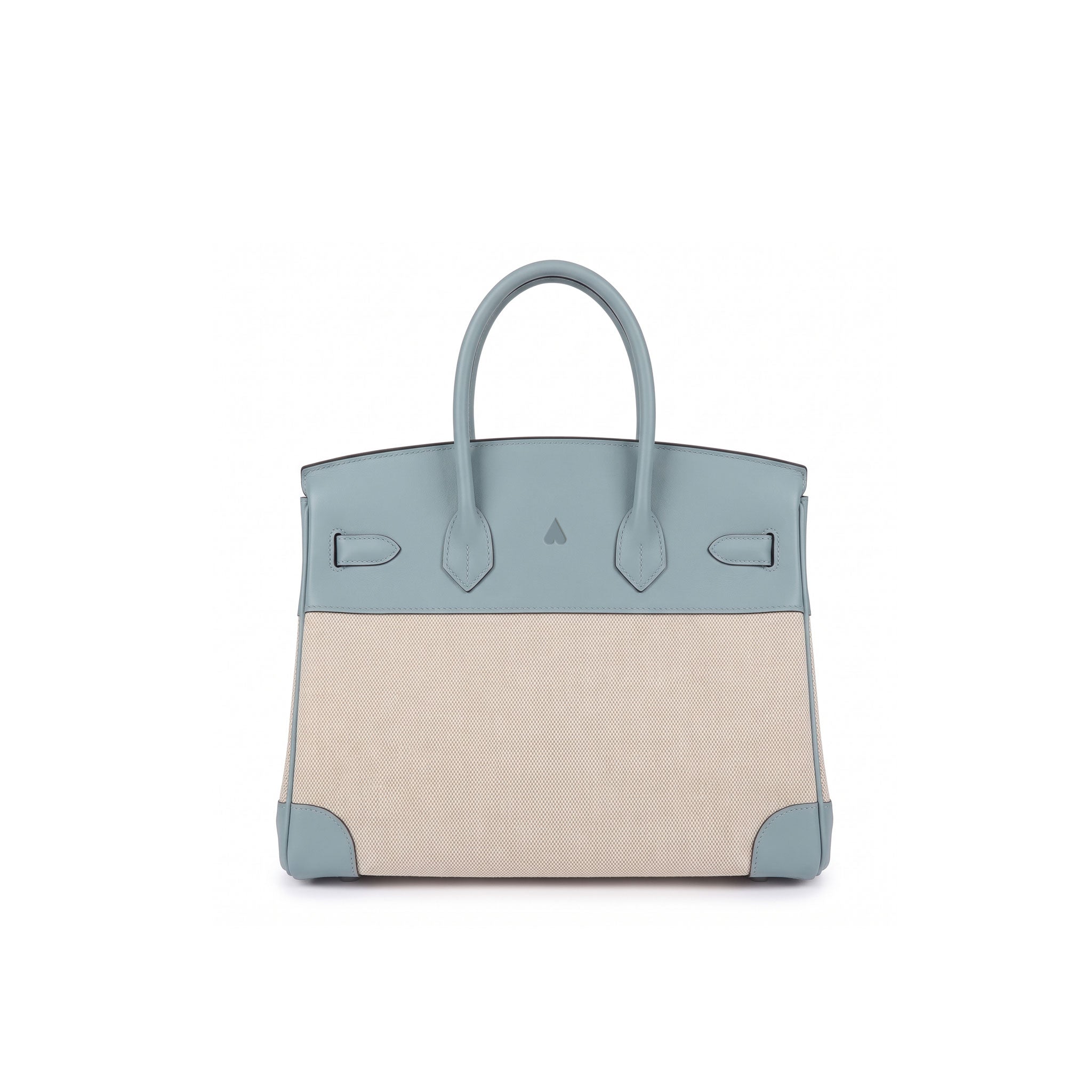 A structured leather handbag with a colorblock design, featuring a dusty blue top section and handles, and a beige canvas lower body, shown against a plain white background.