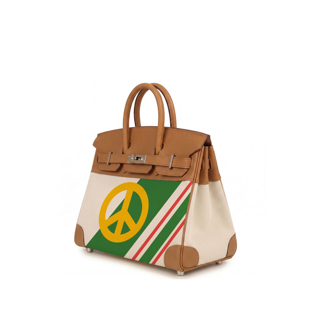 A structured leather handbag with tan handles and trim, cream side panels, and a front panel featuring a green stripe with red and white accents and a large yellow peace sign.