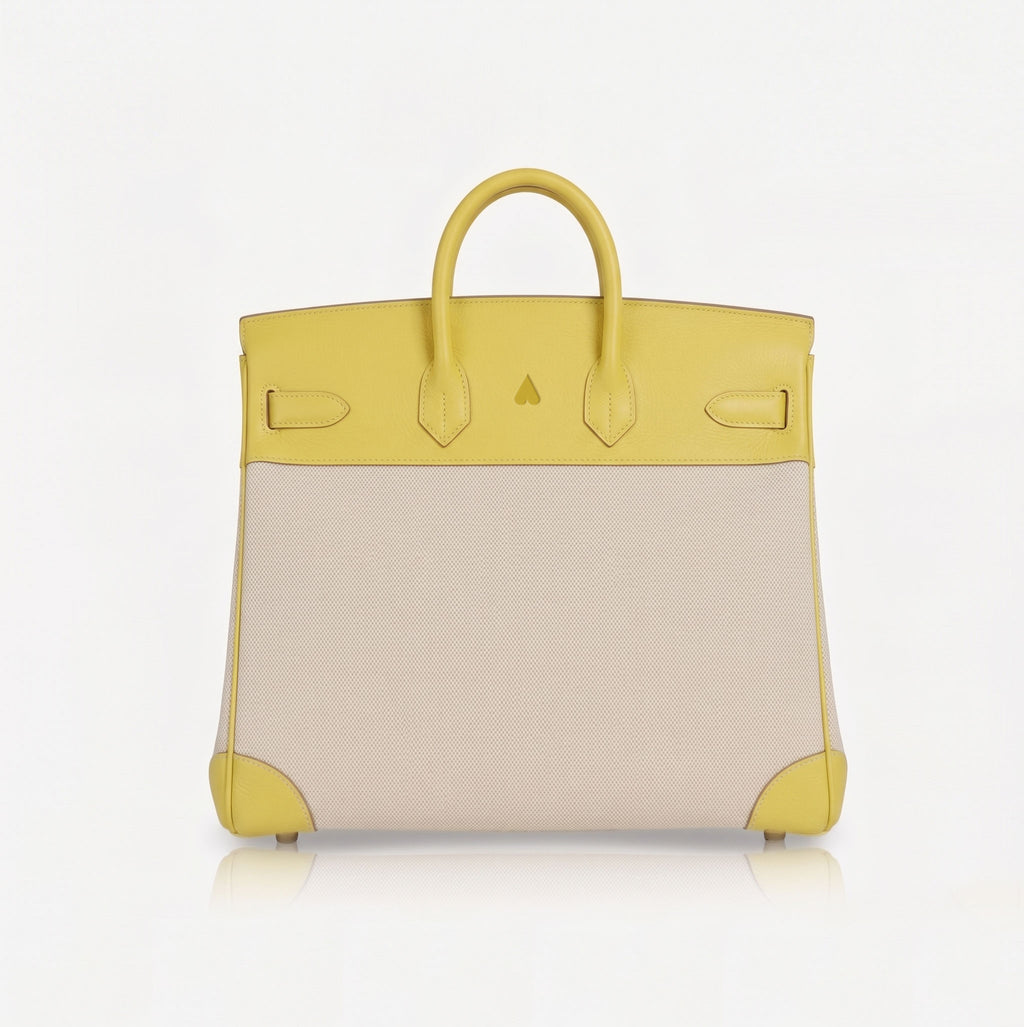 A structured handbag with a two-tone color-blocked design, featuring a bright yellow leather top half and handles with a light beige textured lower half, shown against a plain white background.