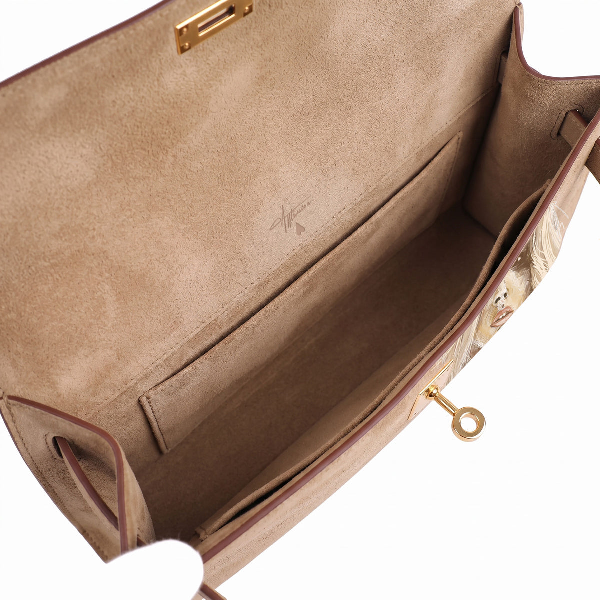 Crafted from luxurious beige calfskin suede, the Kali Long clutch pochette combines a soft, velvety texture. Designed with a refined top handle, slim closure straps, and polished gold-tone twist-lock hardware, with front gorgeous art print, interior is beige suede with inside pocket