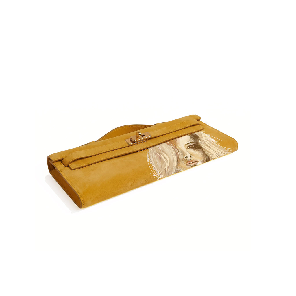 Crafted from luxurious yellow calfskin suede, the Kali Long clutch pochette combines a soft, velvety texture. Designed with a refined top handle, slim closure straps, and polished gold-tone twist-lock hardware, with front gorgeous art print