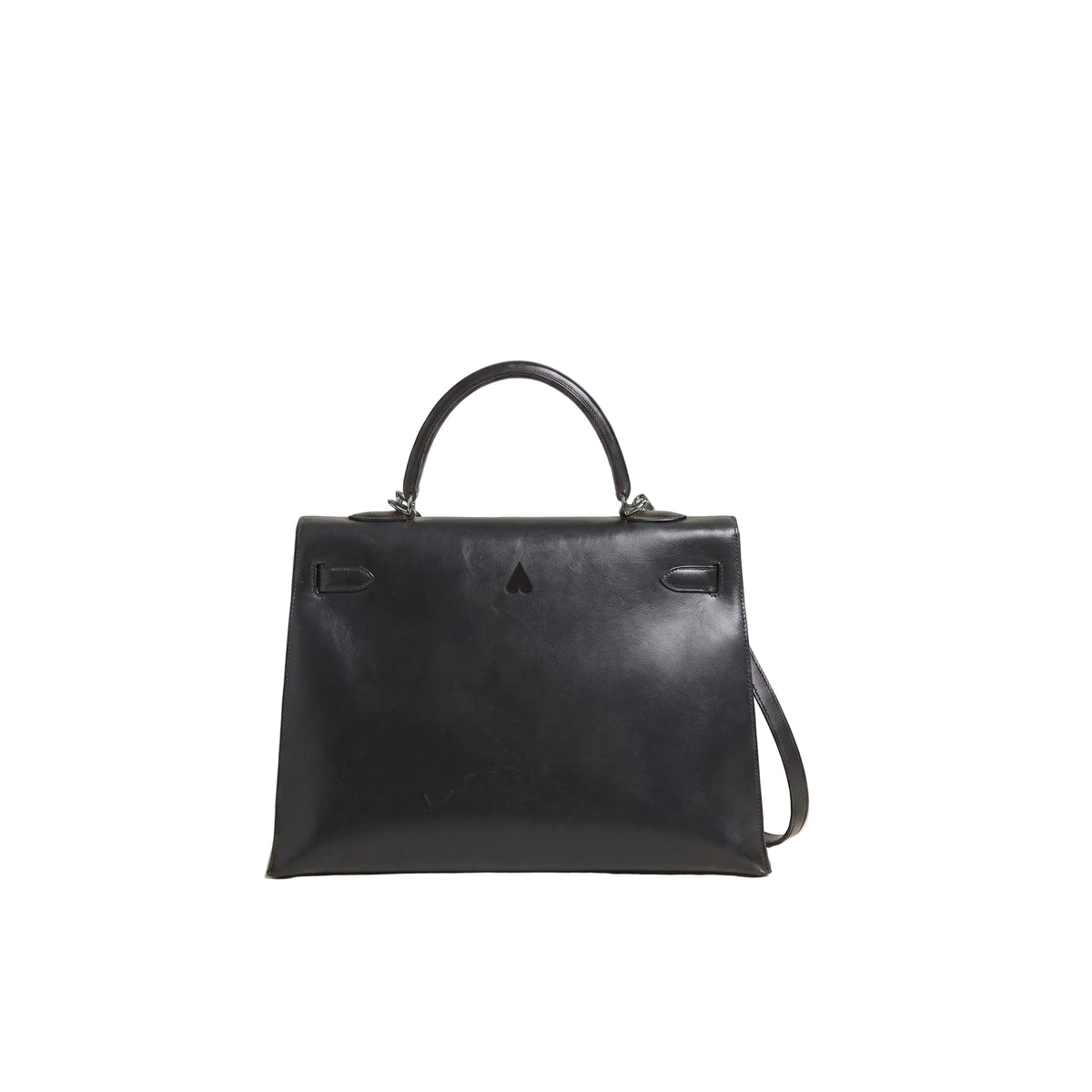 A black leather top-handle handbag with a structured rectangular silhouette, silver-tone hardware, and a small central logo emblem, photographed on a clean light white background.