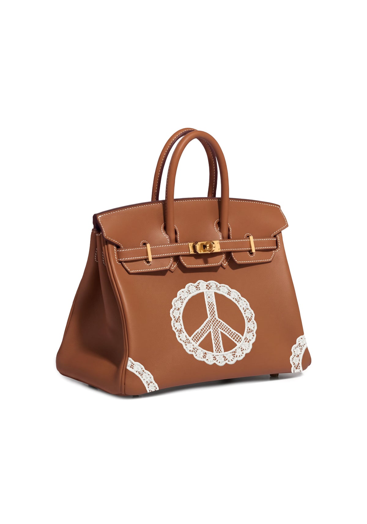 A brown leather handbag with gold-tone hardware and a large white lace peace sign appliqué on the front, shown against a plain white background.