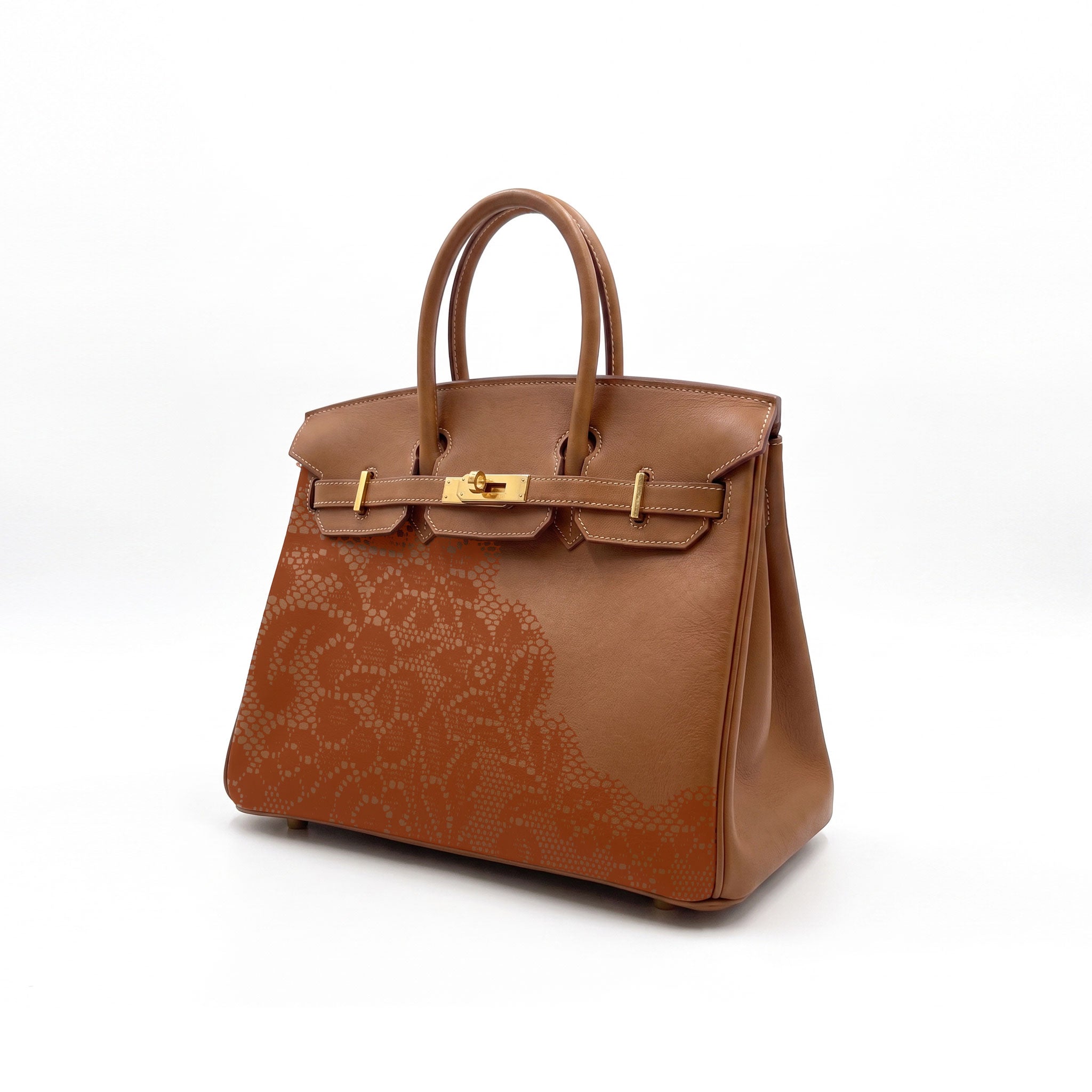 A brown leather handbag with a gold-tone turn-lock closure and a subtle tonal floral pattern on the front, set against a plain white background.