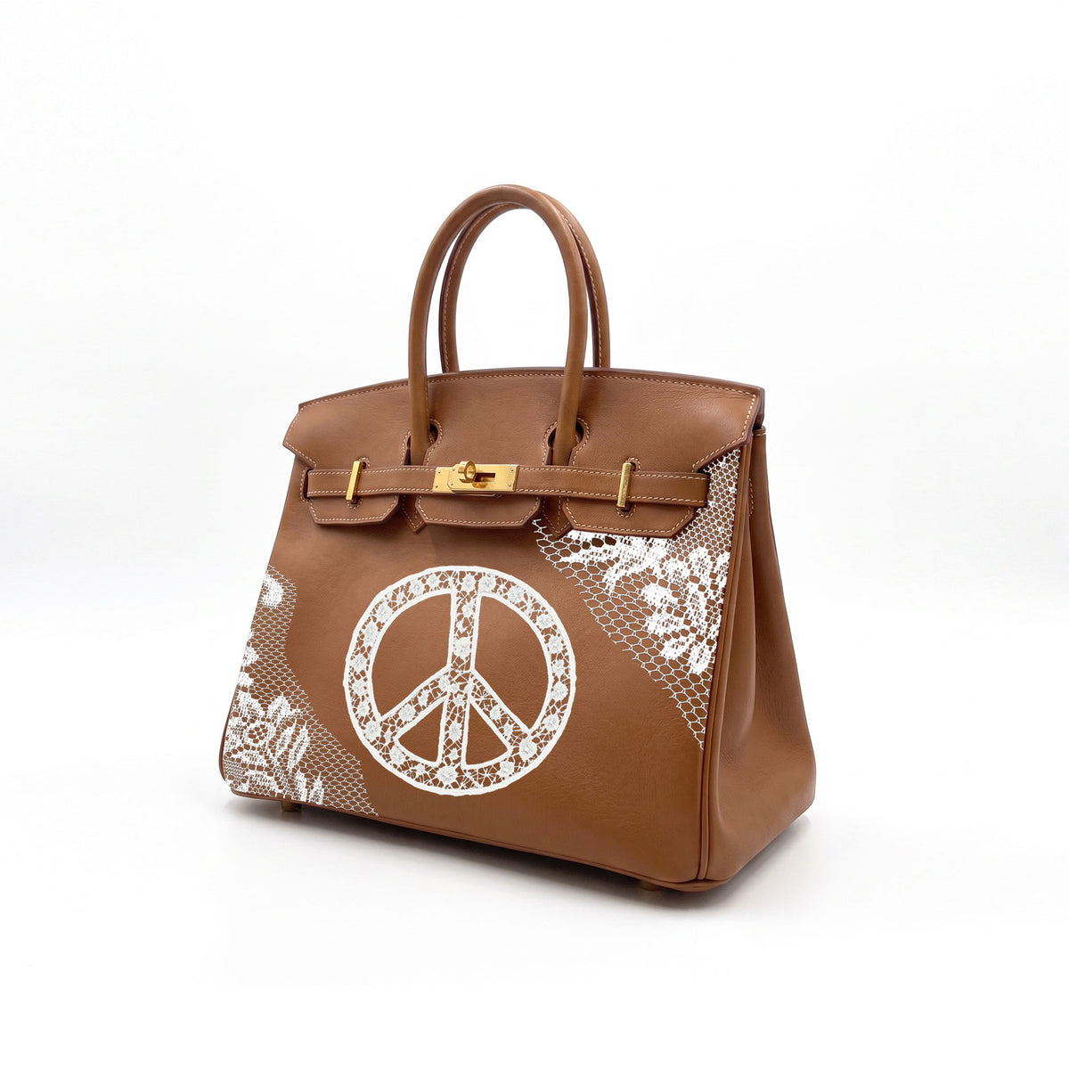 A brown leather handbag with gold-tone hardware, featuring a large white peace sign motif and white floral lace-like print on the front, set against a plain white background.
