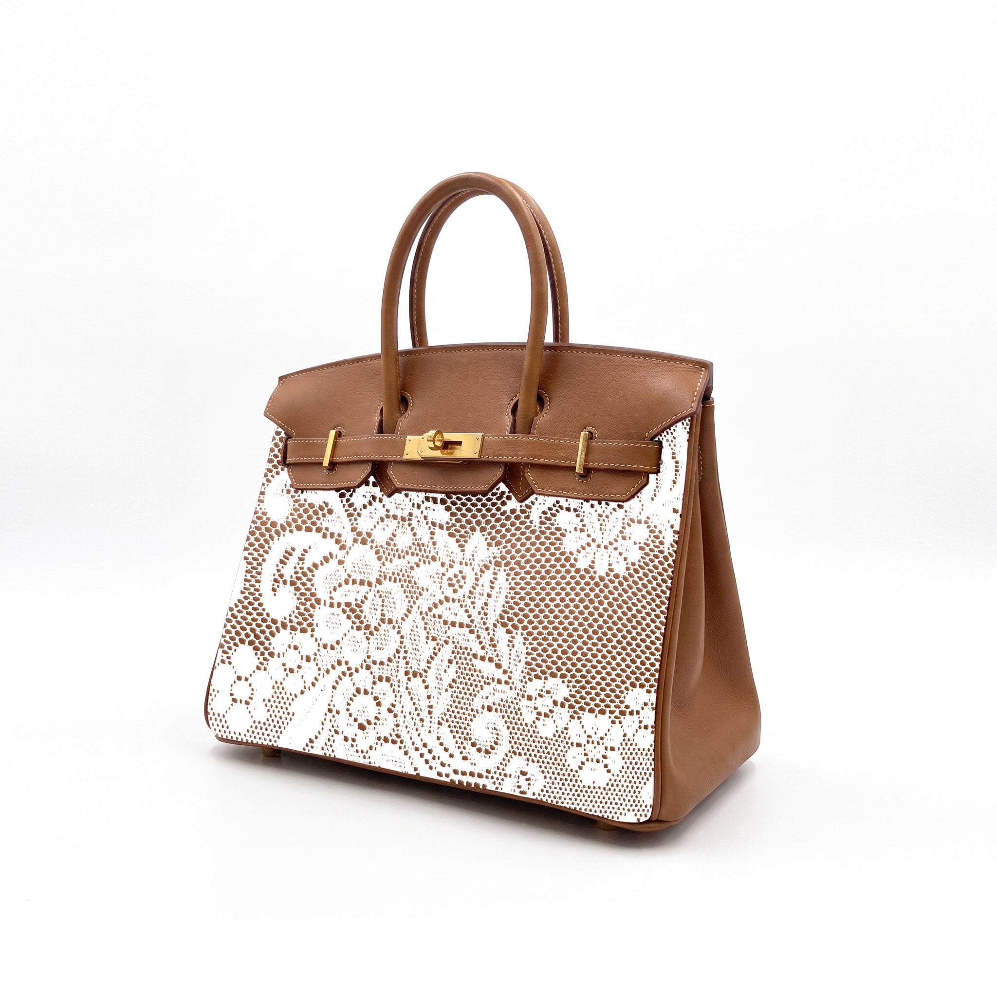 A structured brown leather handbag with a white floral lace overlay on the front, featuring dual top handles and a gold-tone turn-lock closure on a clean white background.