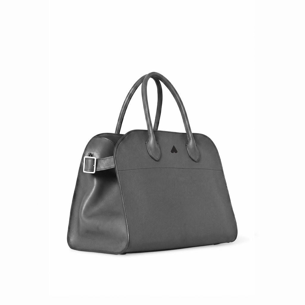 A dark grey leather handbag with dual top handles, a structured dome shape, and a small black triangular logo on the front, shown against a plain white background.