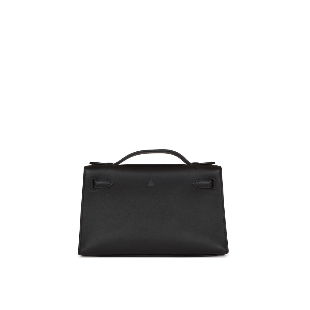 A black leather top-handle handbag with structured rectangular silhouette, displayed against a solid white background.