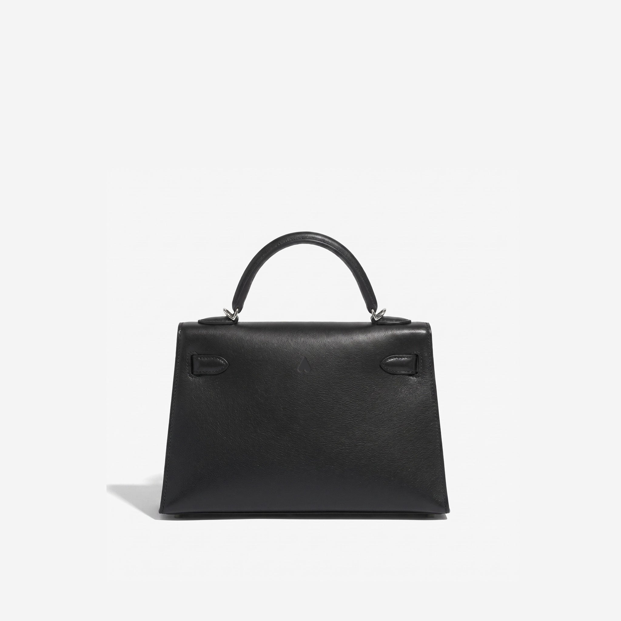 A structured black leather handbag with a top handle and silver-tone hardware, photographed against a clean white background.