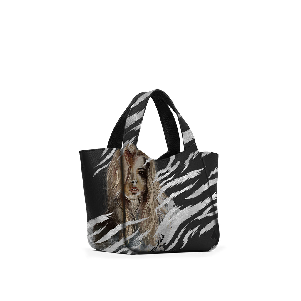 Eve Orange Silver Handbag is crafted from supple deerskin leather with a naturally grainy finish and distinguished by a gorgeous artistic front print