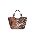 Eve Gold Zebra Handbag is crafted from supple deerskin leather with a naturally grainy finish and distinguished by a gorgeous artistic front print