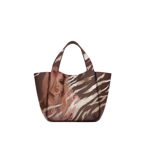 Eve Gold Zebra Handbag is crafted from supple deerskin leather with a naturally grainy finish and distinguished by a gorgeous artistic front print