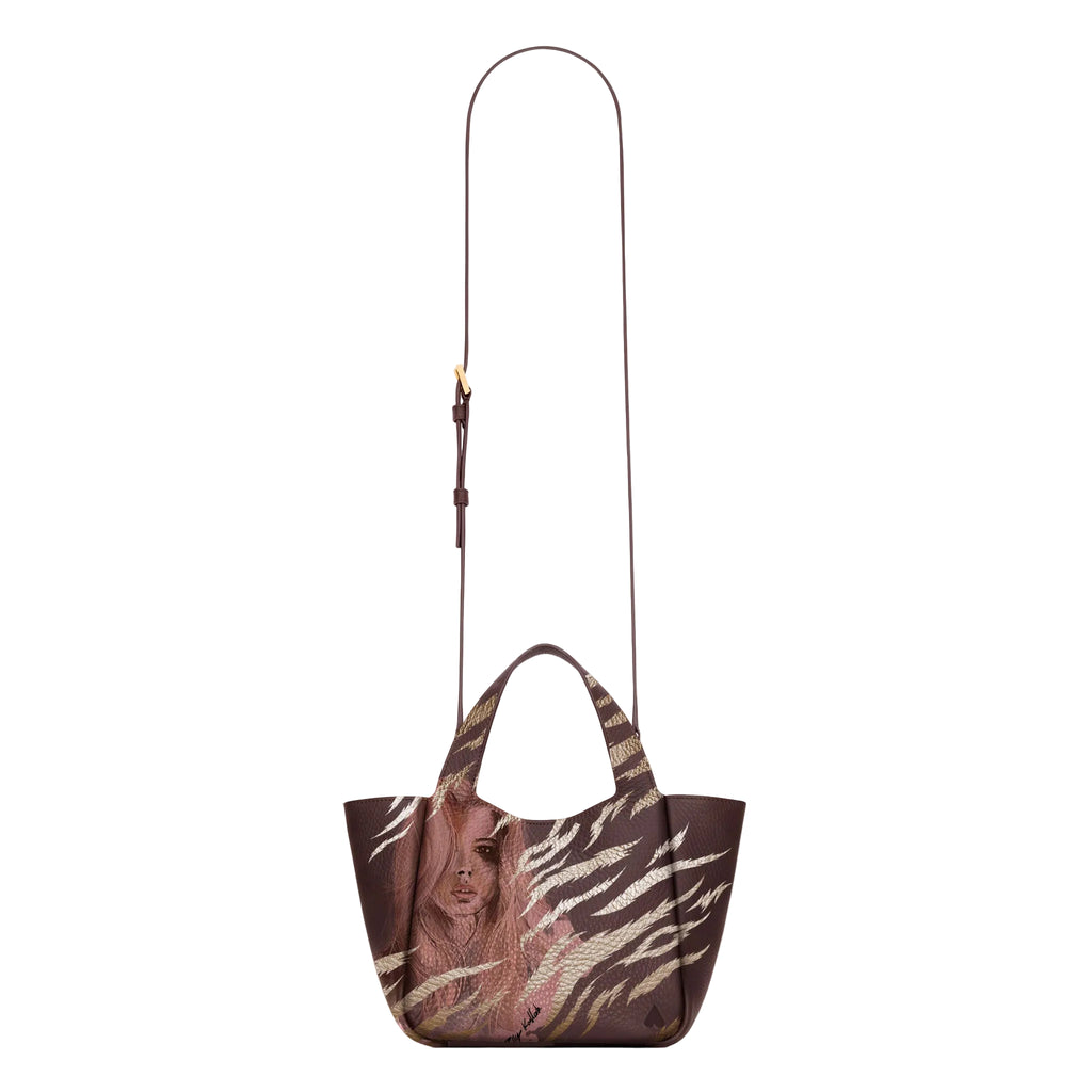 Eve Gold Zebra Handbag is crafted from supple deerskin leather with a naturally grainy finish and distinguished by a gorgeous artistic front print with strap