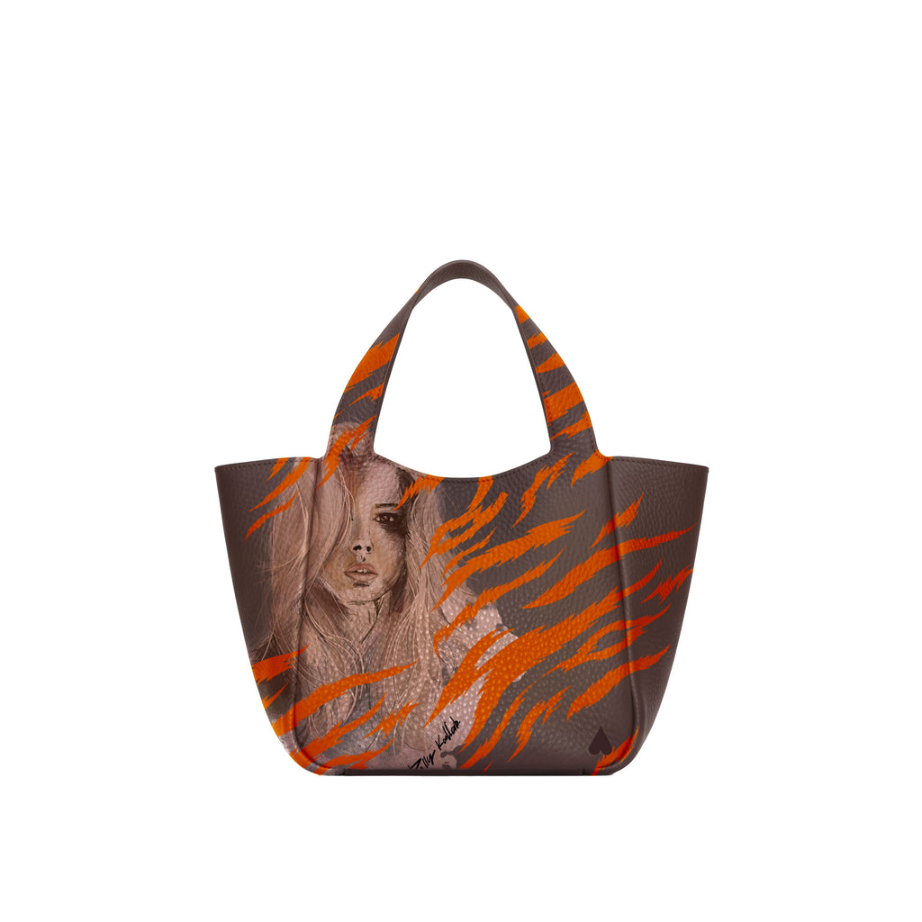 Eve Orange Zebra Handbag is crafted from supple deerskin leather with a naturally grainy finish and distinguished by a gorgeous artistic front print