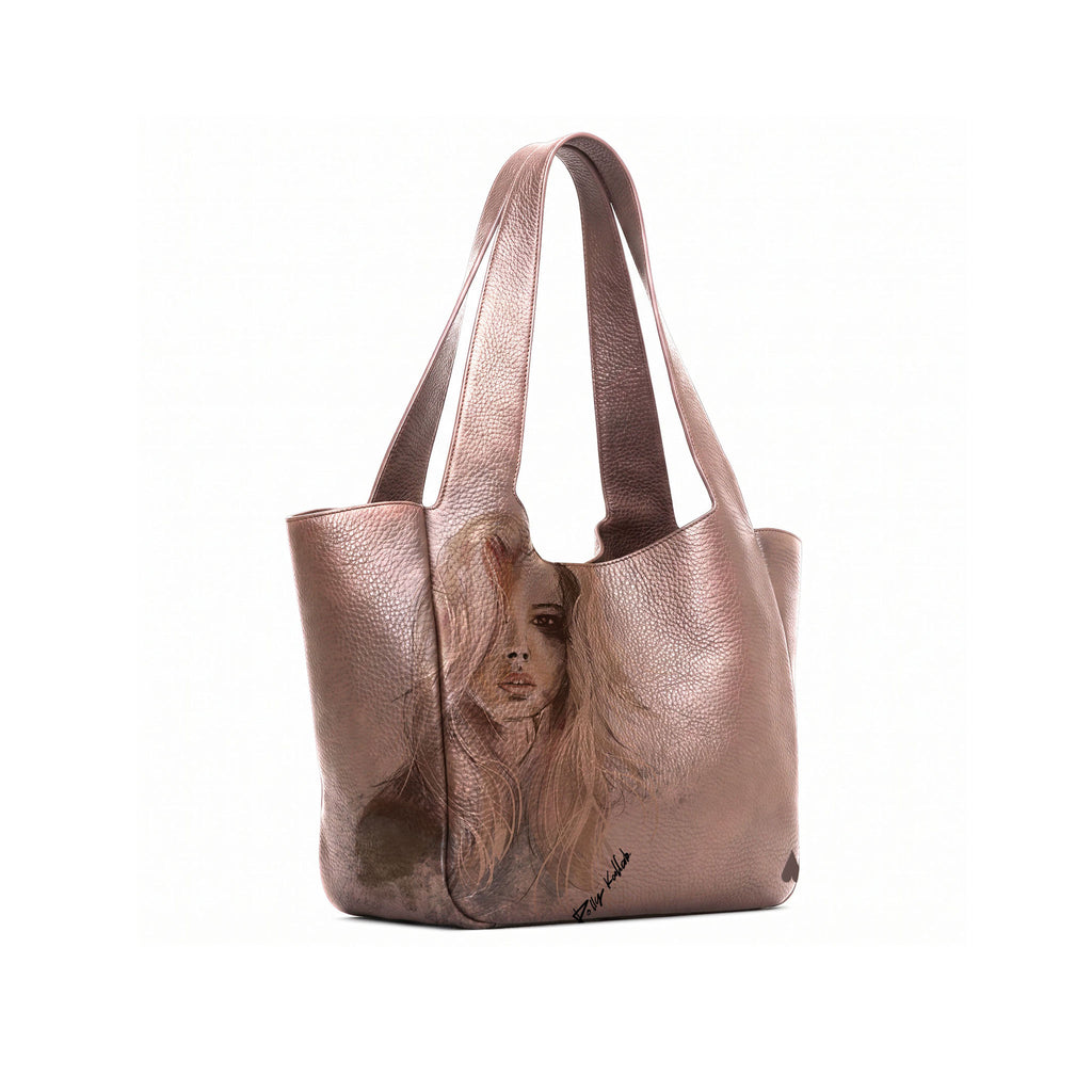 A bronze leather tote bag with a printed portrait of a woman on the front panel, shown open against a plain white background.