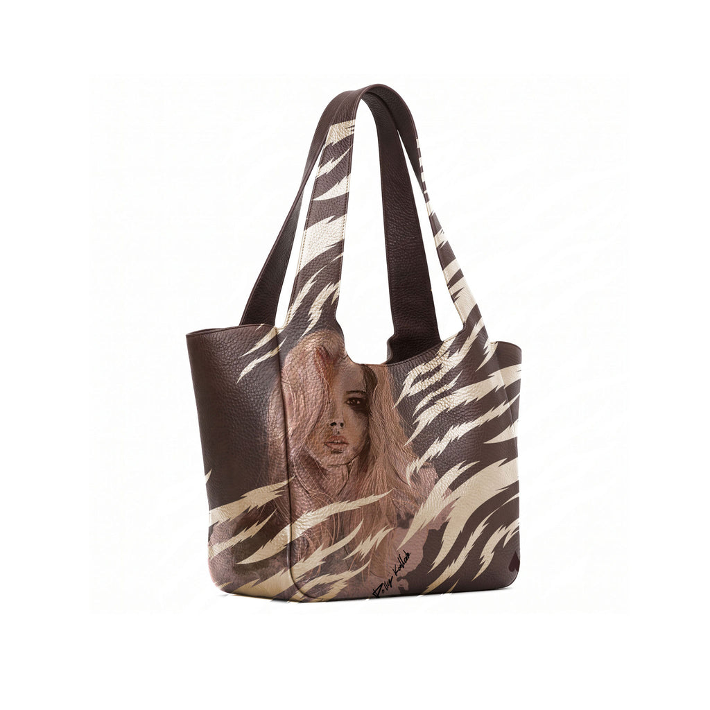 A dark brown leather tote bag with a printed illustration of a woman with long hair on the lower front panel, shown open against a white background.