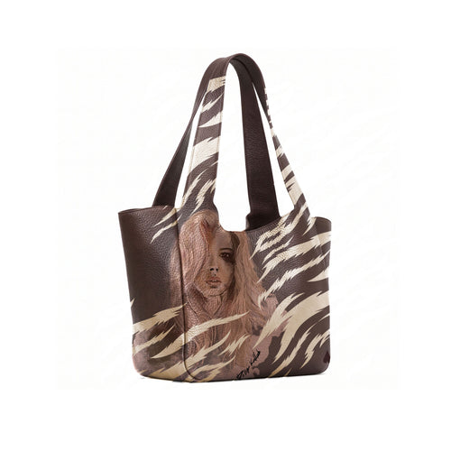 A dark brown leather tote bag with a printed illustration of a woman with long hair on the lower front panel, shown open against a white background.