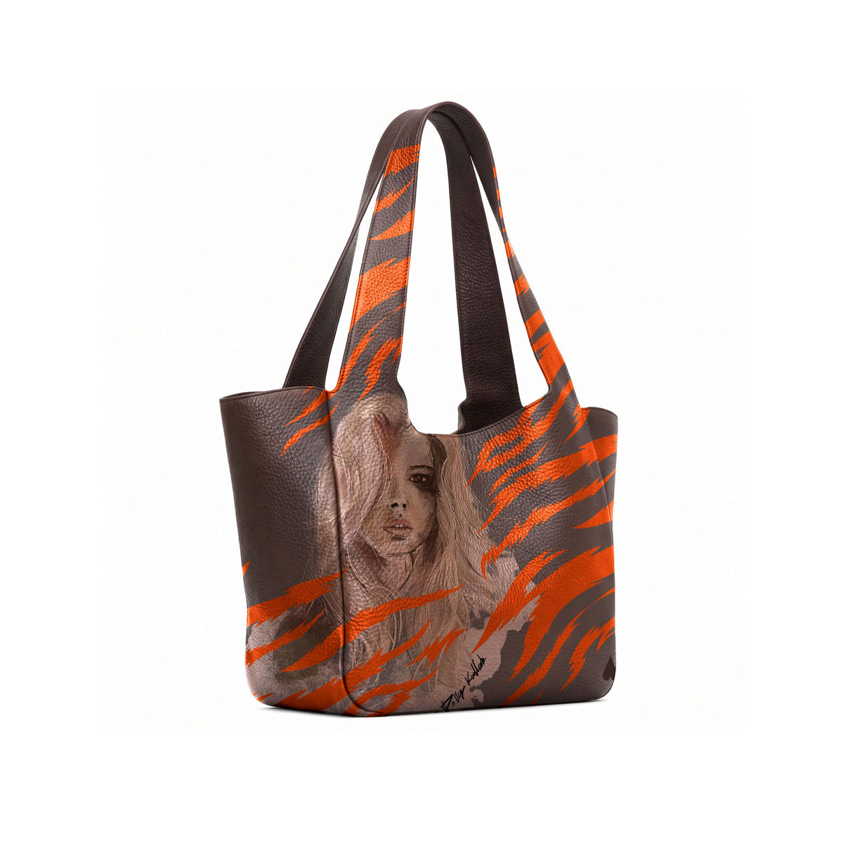 A brown tote bag with a orange zebra-stripe pattern and a printed portrait of a woman with long light brown hair on the front, shown against a plain white background. 